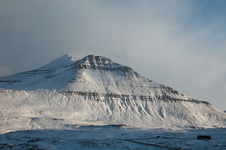 Photo of snow-capped Slattaratindur Peak, the highest mountain in the Faroe Islands, on the island of Esturoi