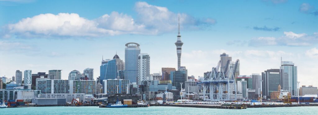 panoramic photo of Auckland, New Zealand's largest city, on a clear, sunny day from the ocean