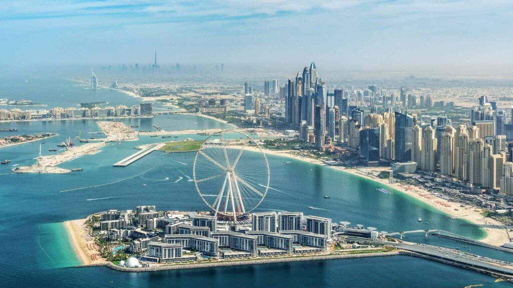 photo of a bird's-eye view of Dubai Marina and the Dubai Eye Ferris wheel, UAE