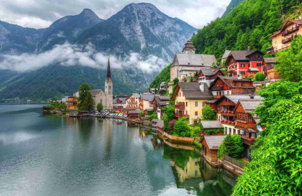 Photo of Hallstatt village on the water on the background of the Alps in Austria