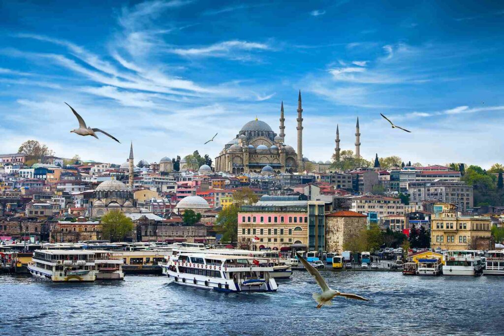 beautiful photo on the Istanbul pier in the tourist part of the city in Turkey with beautiful blue sky and flying seagulls over the sea