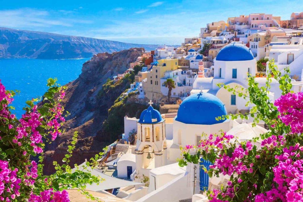 A photo of an incredible view of the island of Santorini, one of the most visited places on Instagram in Greece, the photo shows a view of the sea, mountains and beautiful houses