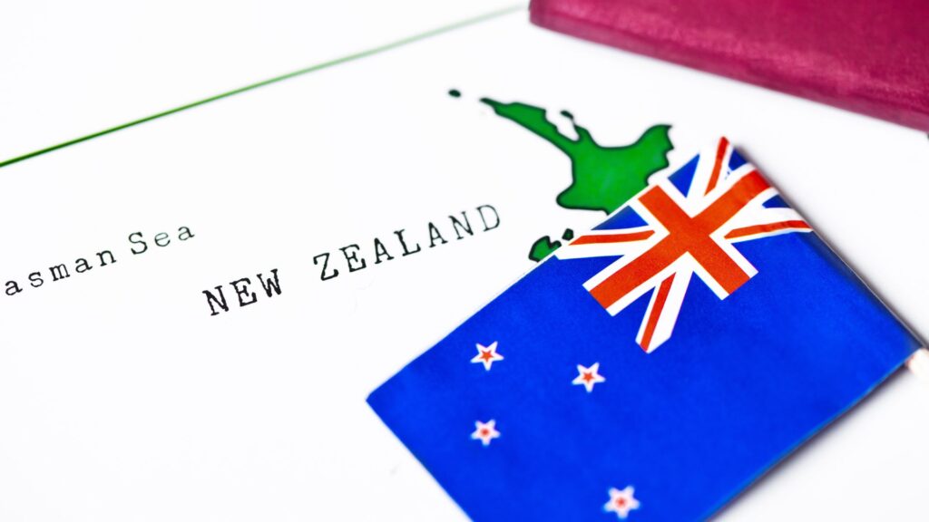 The New Zealand flag is on a map that says New Zealand